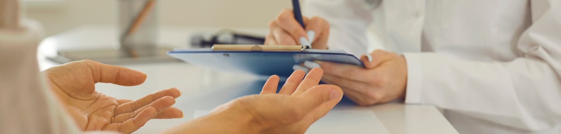2026–2027 Foundation Pipeline What Healthcare Organizations Should Know About Upcoming Funding Opportunities (1) Two people in discussion; one holds out hands while the other writes on a clipboard, possibly related to grant writing.
