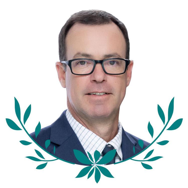 Man in suit and glasses with laurel design, ideal for a grant writing expert profile.